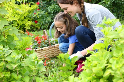 Gardener inspecting a residential garden site for hazards